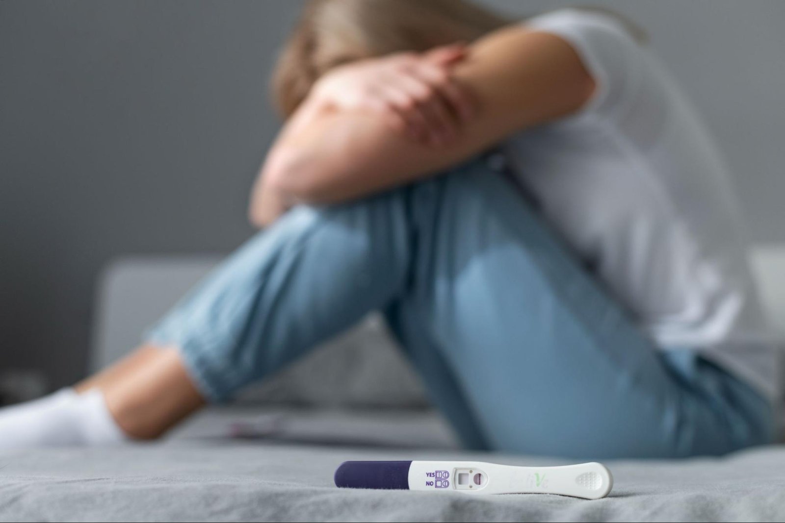 Woman feeling emotional after negative pregnancy test