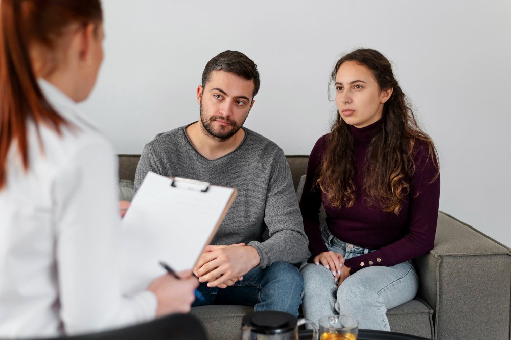 Couple consulting fertility specialist during IVF
